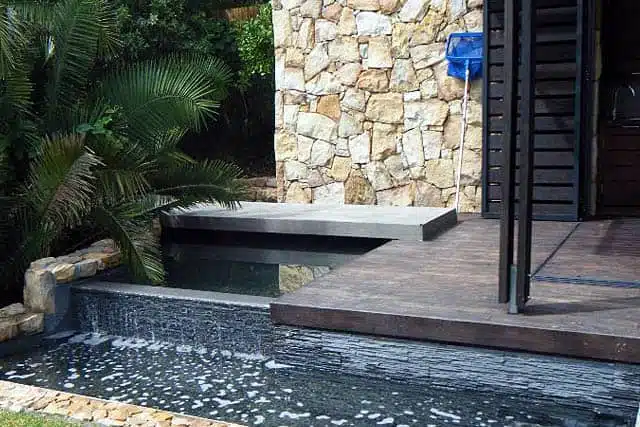 creative cascades pool services water features water in motion rimflow pond with cladding hout bay